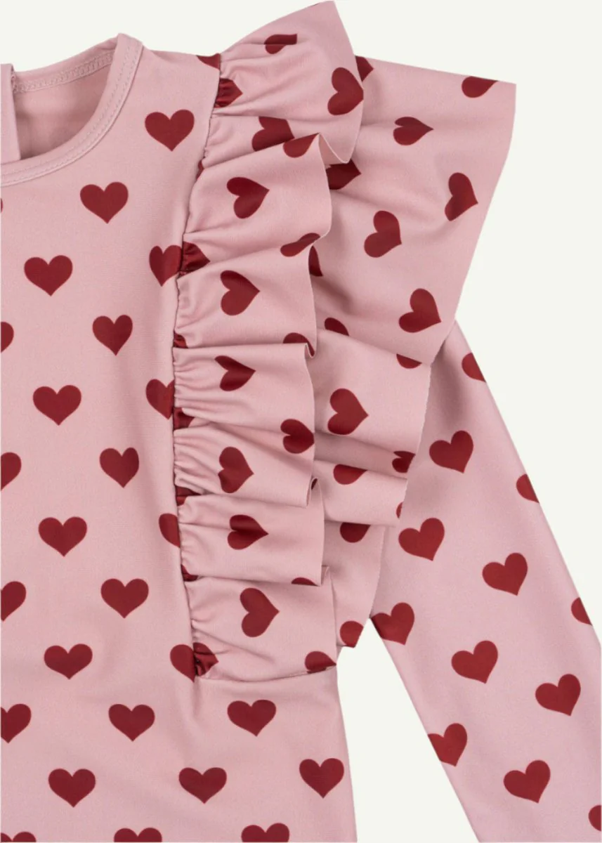 Konges Sloejd | Manuca Frill Onesie in Amour Pink: UPF 50+ Heart Pattern Sun Protection - Image 3
