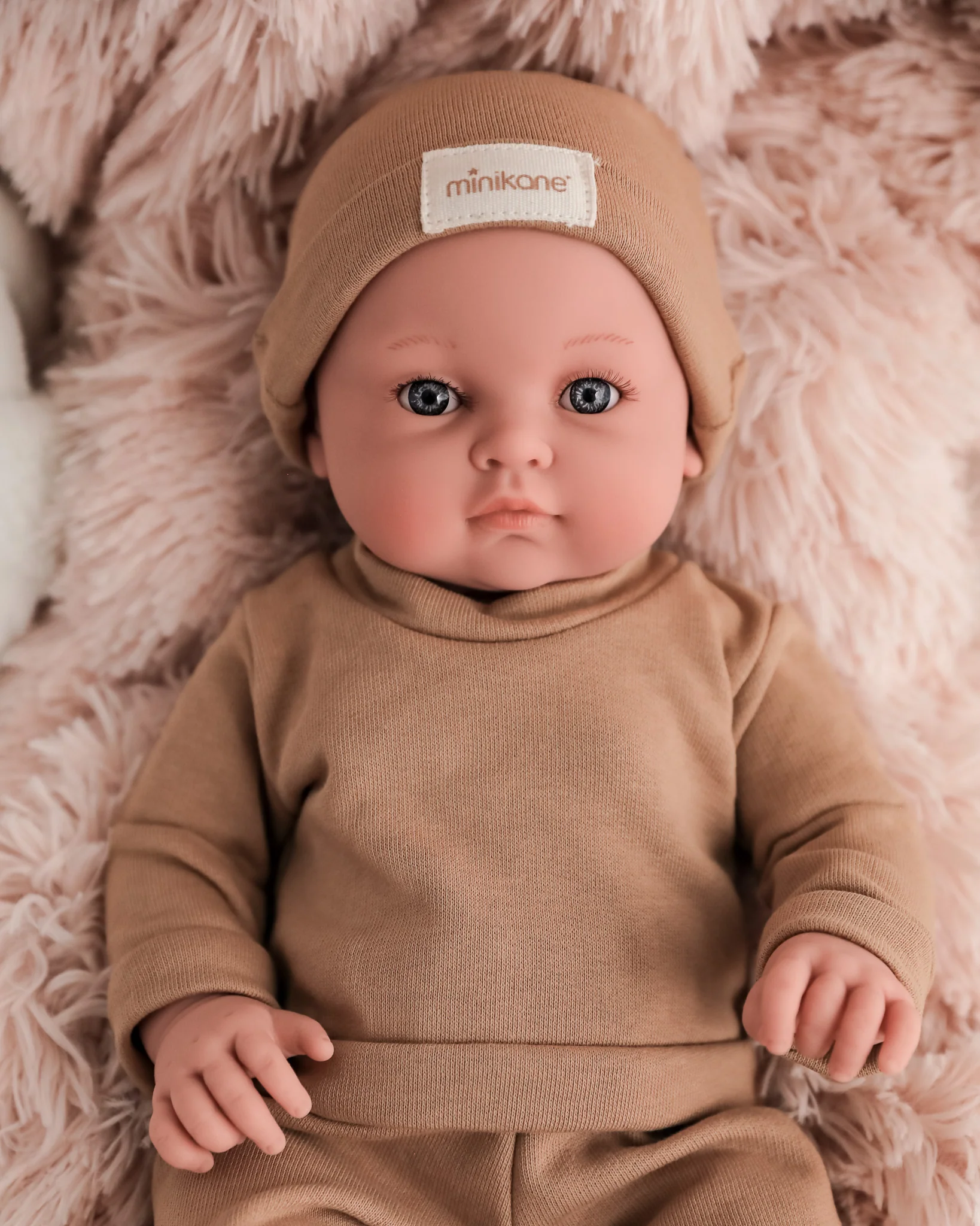 Minikane Doll | 18" Bambini Boy Doll Yann in Brown Fleece Outfit - Image 2