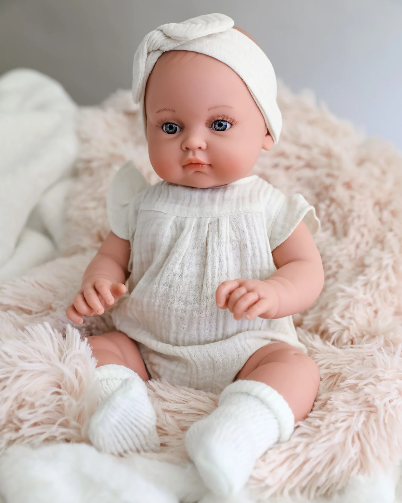 Minikane Doll | 18" Bambini Girl Doll Yaelle in White Romper - Image 2