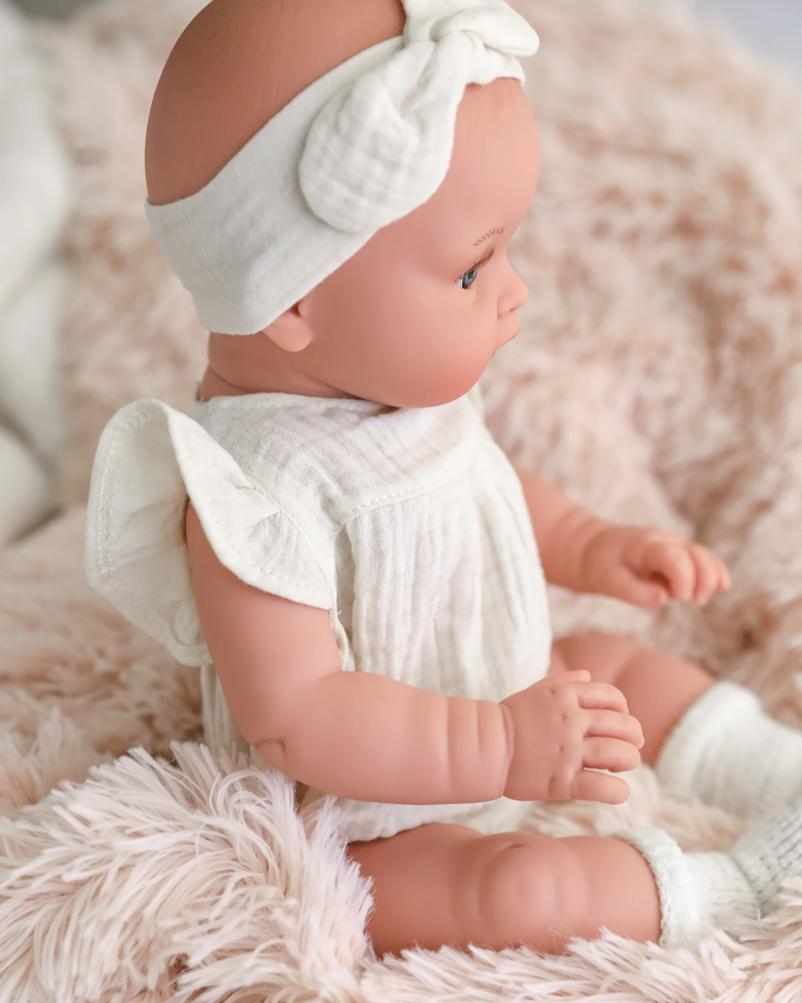 Minikane Doll | 18" Bambini Girl Doll Yaelle in White Romper - Image 3